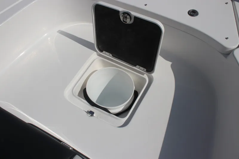 Slide: The Image of 2026 Tidewater 2500 Carolina Bay boat with sleek T-top design against blue sky. - 23