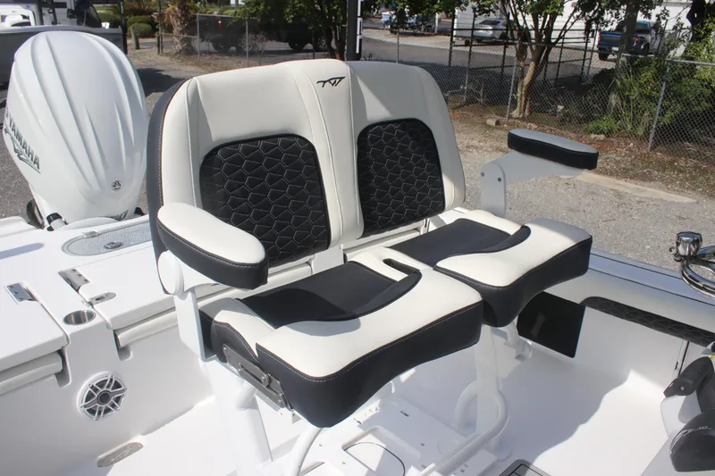 Slide: The Image of 2026 Tidewater 2500 Carolina Bay boat with cushioned seating and sleek design. - 24