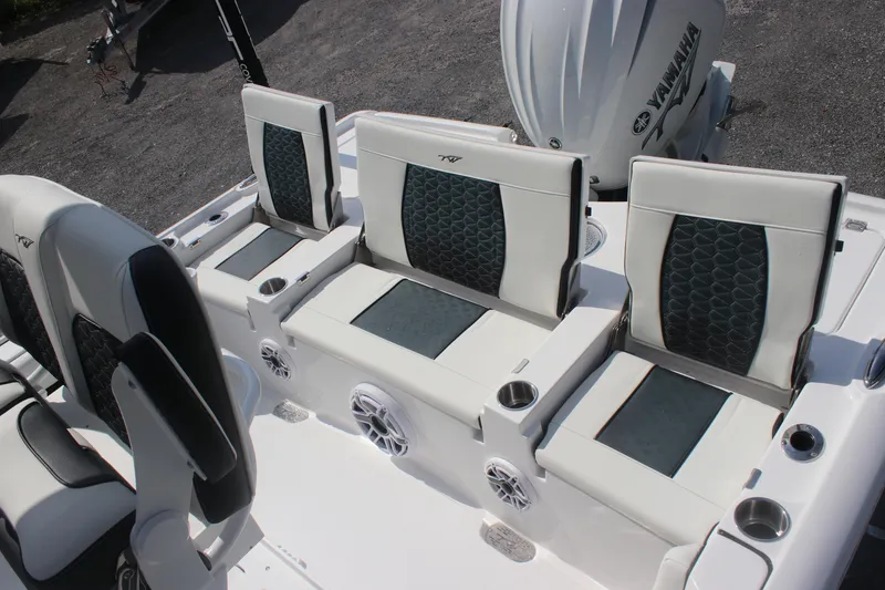 Slide: The Image of 2026 Tidewater 2500 Carolina Bay boat seating with dual cushioned chairs and armrests. - 27