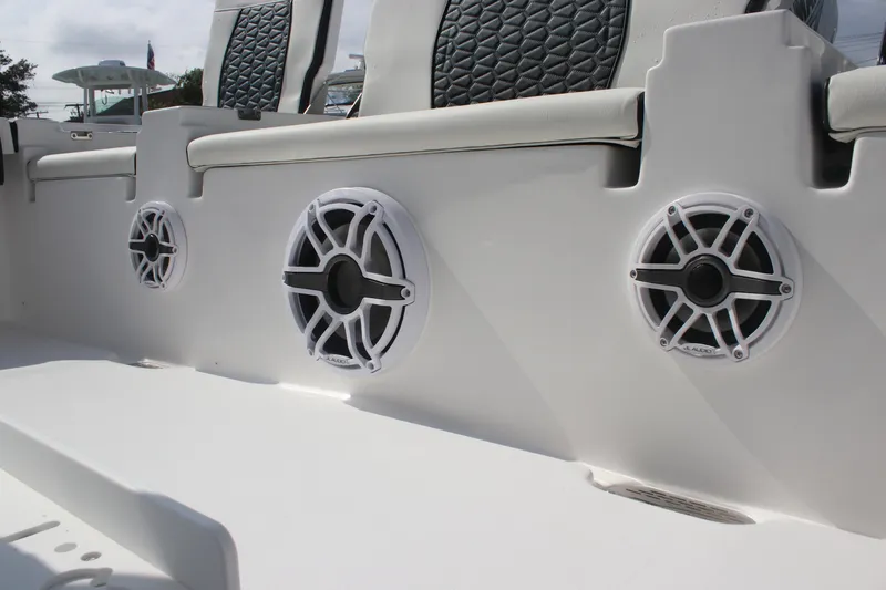 Slide: The Image of 2026 Tidewater 2500 Carolina Bay boat interior with open storage compartment. - 28