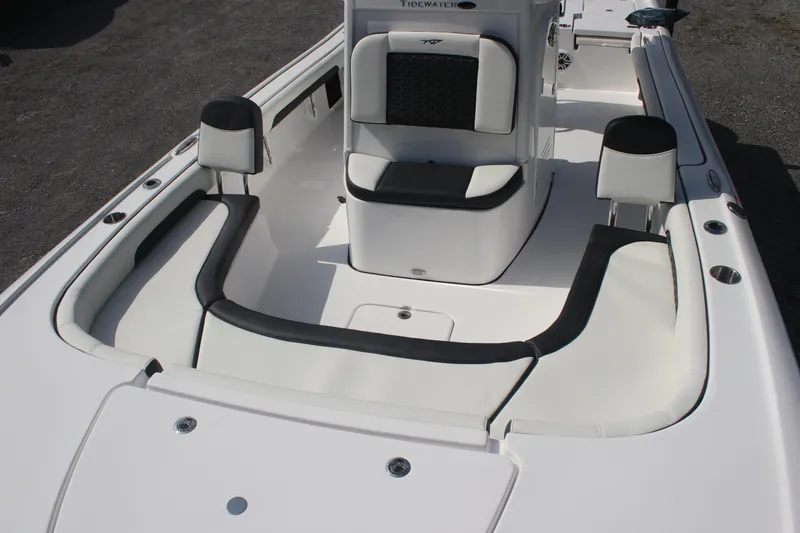 Slide: The Image of 2026 Tidewater 2500 Carolina Bay boat interior with cushioned seating and sleek design. - 35