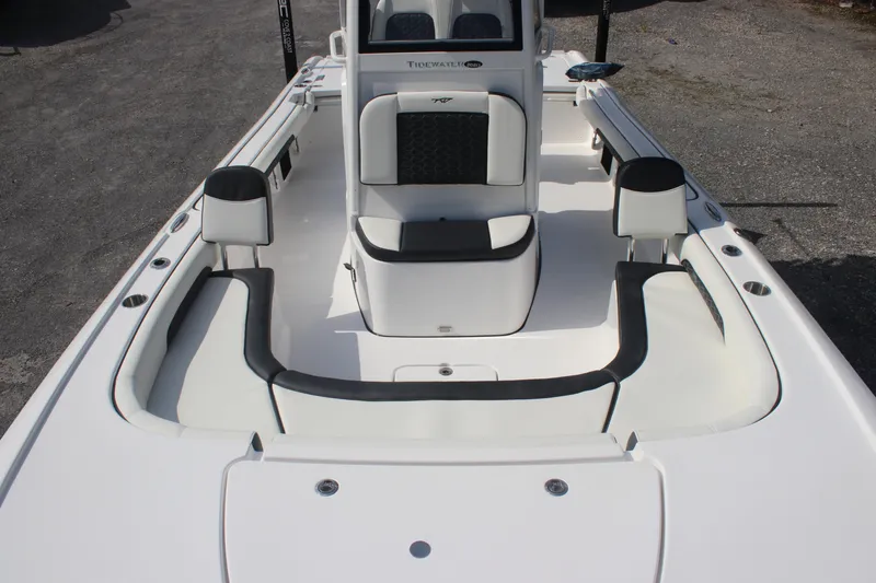Slide: The Image of 2026 Tidewater 2500 Carolina Bay boat interior with seating and console. - 36