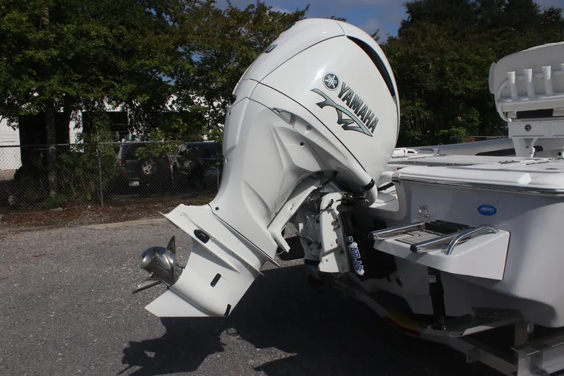 Slide: The Image of 2026 Tidewater 2500 Carolina Bay boat interior with storage compartments and seating. - 8