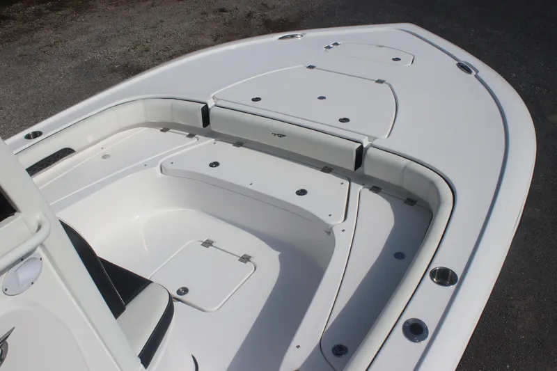 Slide: The Image of 2026 Tidewater 2500 Carolina Bay boat seating with black and white cushioned design. - 9