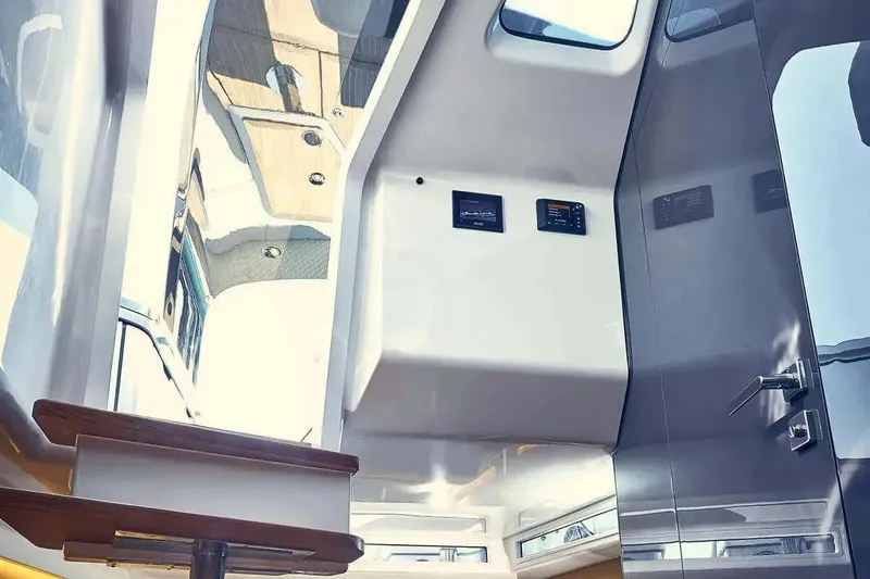Slide: The Image of Interior of 2023 Frauscher 1414 Demon yacht, featuring sleek design and modern controls. - 10