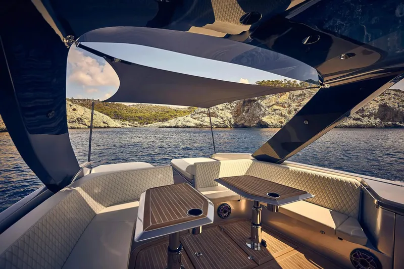 Slide: The Image of Luxurious 2023 Frauscher 1414 Demon yacht interior with elegant seating and scenic ocean view. - 3