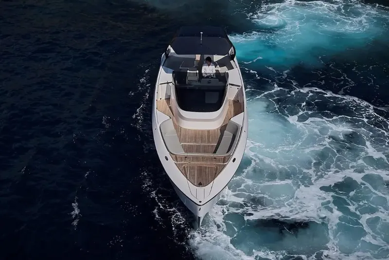 Slide: The Image of 2023 Frauscher 1414 Demon yacht cruising on open water, aerial view. - 9