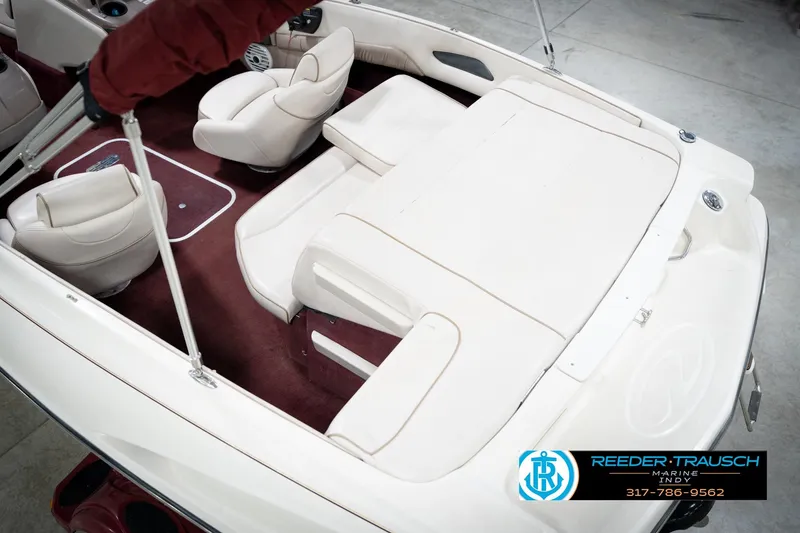 Slide: The Image of 1998 Regal 1700 LSR boat interior with white seats and red carpet. - 14