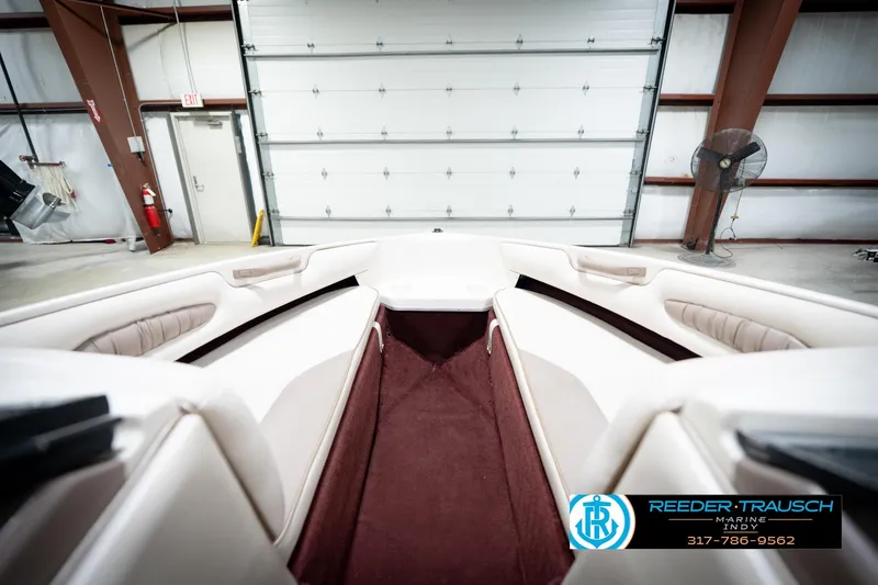 Slide: The Image of Interior of a 1998 Regal 1700 LSR boat in a garage setting. - 17