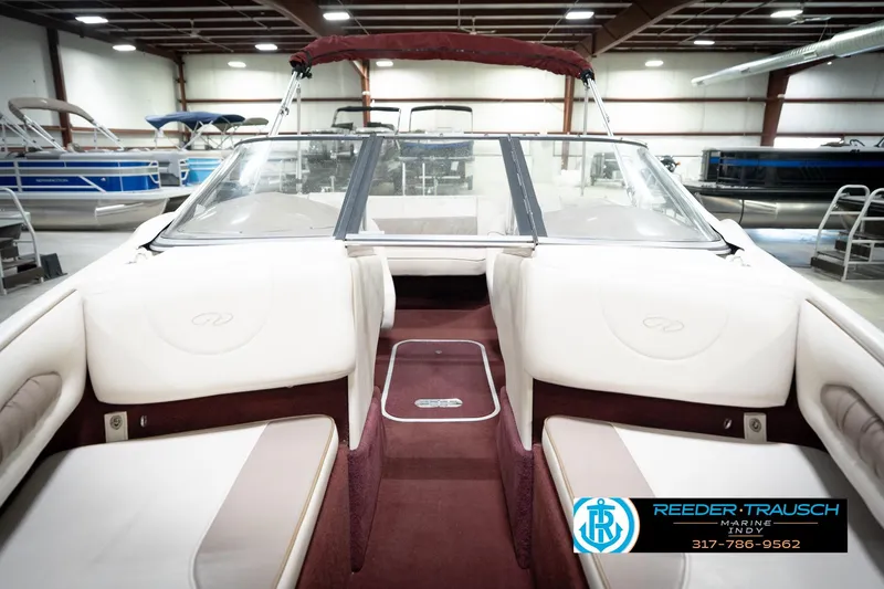 Slide: The Image of Interior of a 1998 Regal 1700 LSR boat in a showroom. - 18