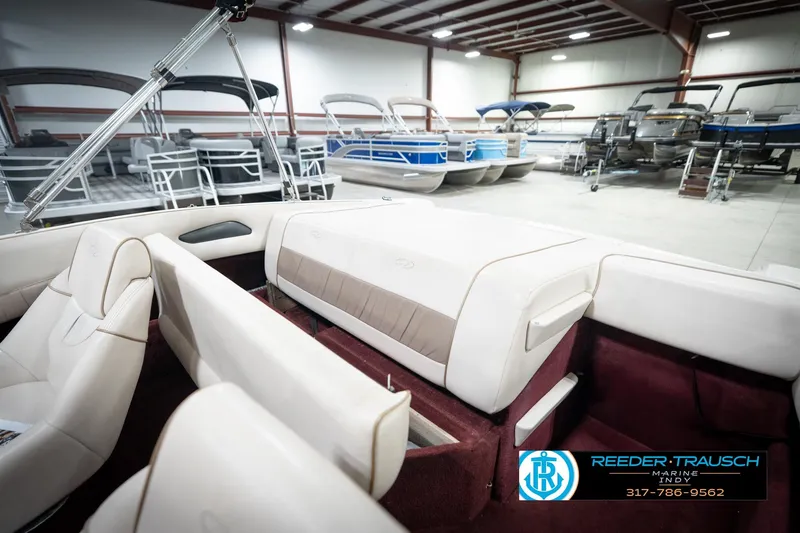 Slide: The Image of Interior of a 1998 Regal 1700 LSR boat in a showroom. - 21
