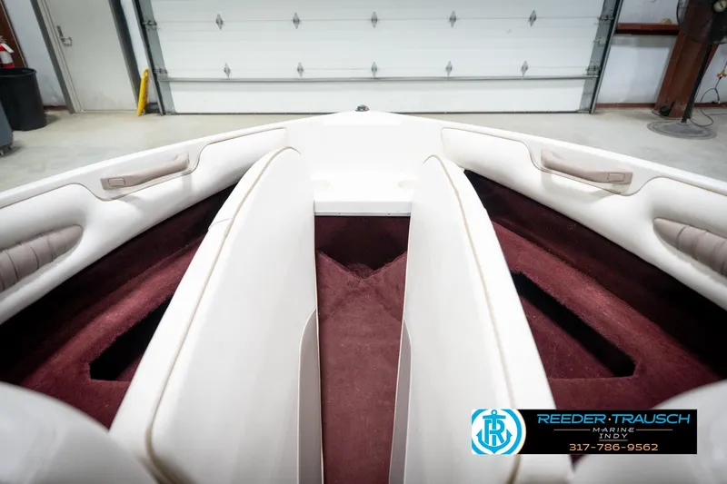 Slide: The Image of Interior view of a 1998 Regal 1700 LSR boat with white and maroon seating. - 23