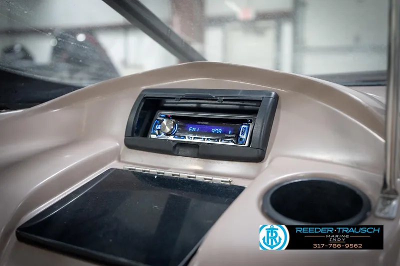 Slide: The Image of 1998 Regal 1700 LSR dashboard with Kenwood stereo and cup holder. - 24