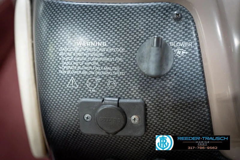 Slide: The Image of 1998 Regal 1700 LSR dashboard with warning labels and blower switch. - 29