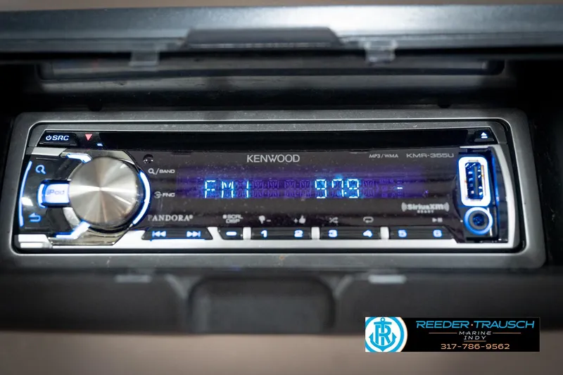 Slide: The Image of Kenwood KMR-355U stereo in a 1998 Regal 1700 LSR boat, displaying FM radio. - 30