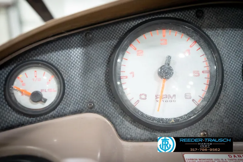 Slide: The Image of Dashboard of a 1998 Regal 1700 LSR boat showing fuel and RPM gauges. - 31