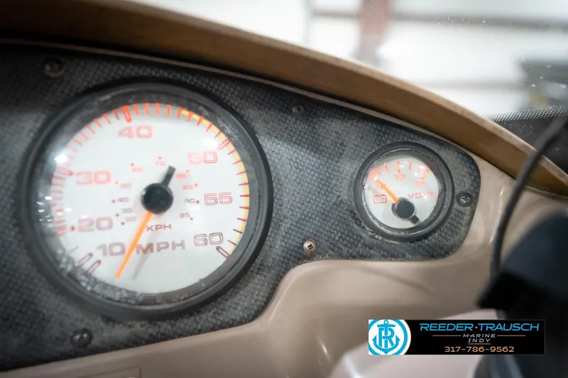 Slide: The Image of Dashboard of a 1998 Regal 1700 LSR boat with speedometer and voltmeter gauges. - 32