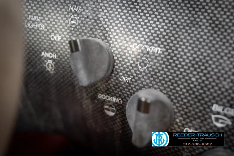 Slide: The Image of Control panel of a 1998 Regal 1700 LSR boat with navigation and docking switches. - 34