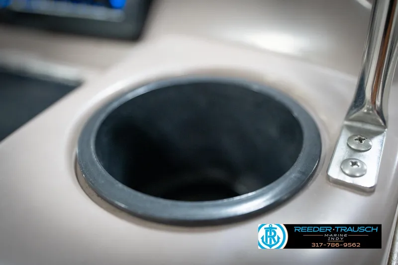 Slide: The Image of Cup holder on a 1998 Regal 1700 LSR boat dashboard, featuring a metal handle. - 41