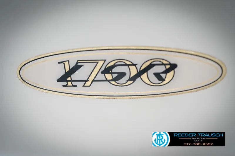 Slide: The Image of 1998 Regal 1700 LSR logo with Reeder Trausch Marine contact details. - 47