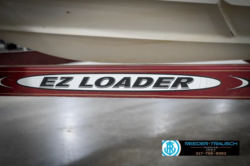 Slide: The Image of EZ Loader trailer for 1998 Regal 1700 LSR boat, Reeder-Trausch Marine logo visible. - 48
