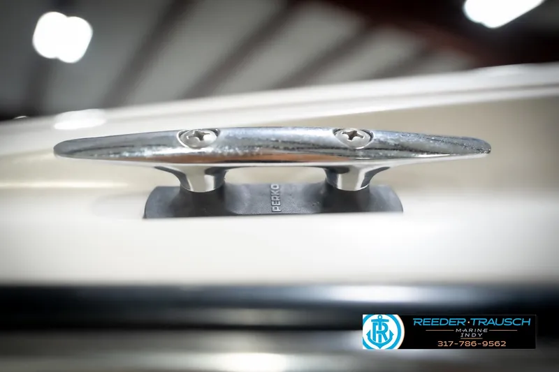 Slide: The Image of Close-up of a 1998 Regal 175 1700LSR boat cleat with Reeder-Trausch Marine logo. - 50