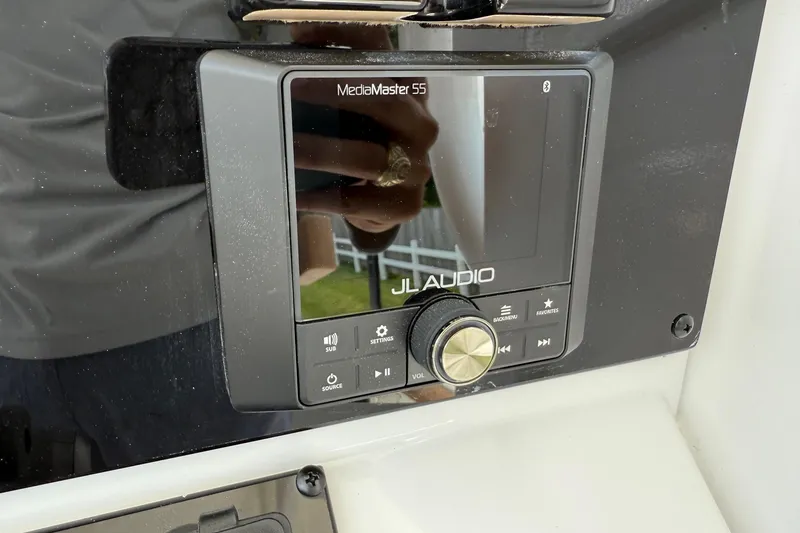 Slide: The Image of JL Audio MediaMaster 55 control panel on 2026 Sea Hunt BX25FS boat dashboard. - 20