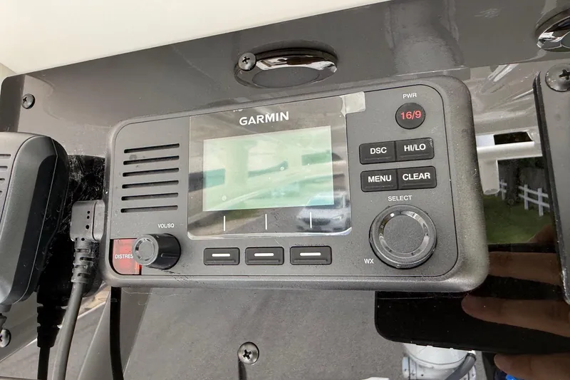 Slide: The Image of Garmin marine radio on 2026 Sea Hunt BX25FS boat dashboard. - 21