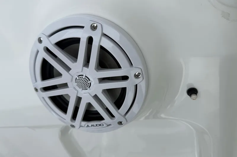 Slide: The Image of White JL Audio speaker on 2026 Sea Hunt BX25FS boat. - 22