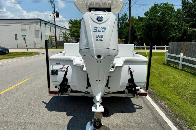 Slide: The Image of 2026 Sea Hunt BX25FS boat with Yamaha 300 V6 engine on a sunny street. - 3