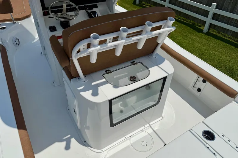 Slide: The Image of 2026 Sea Hunt BX25FS boat interior with rod holders and seating. - 9