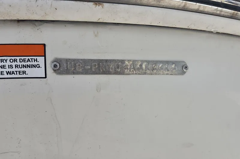 Slide: The Image of 2013 Stingray 194 LX boat identification plate with safety warning label. - 12