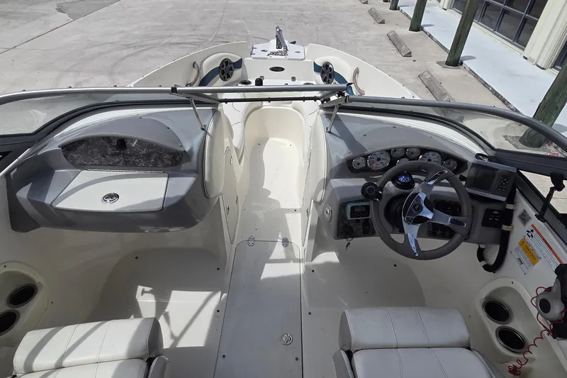 Slide: The Image of 2013 Stingray 194 LX boat interior with steering wheel and dashboard controls. - 8
