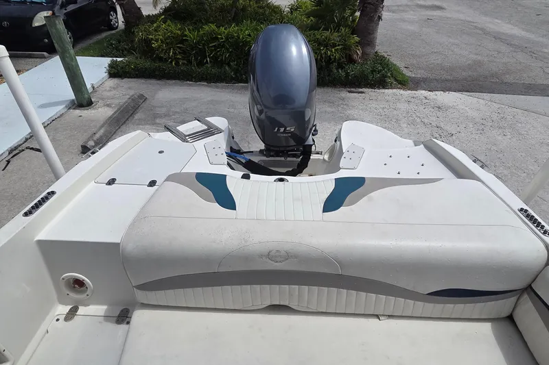 Slide: The Image of 2013 Stingray 194 LX boat with Yamaha 115 outboard motor, rear seating view. - 9