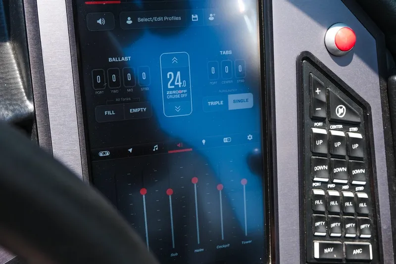 Slide: The Image of 2023 MasterCraft XStar touchscreen control panel with ballast and cruise settings. - 16
