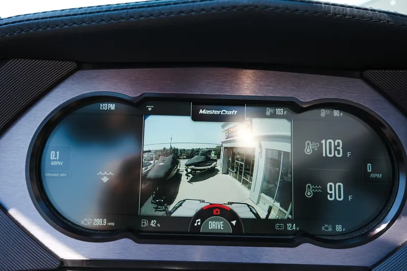 Slide: The Image of 2023 MasterCraft XStar dashboard display showing speed, temperature, and camera view. - 17
