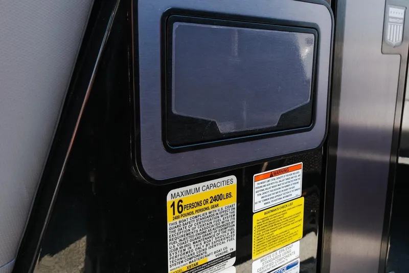 Slide: The Image of 2023 MasterCraft XStar capacity label, indicating a maximum of 16 persons or 2400 lbs. - 21