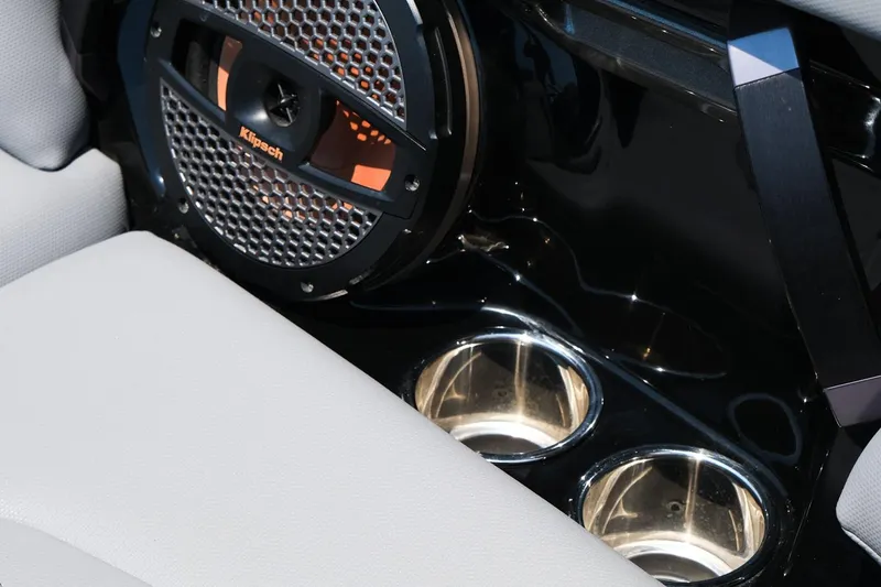 Slide: The Image of 2023 MasterCraft XStar interior with Klipsch speaker and dual cup holders. - 23