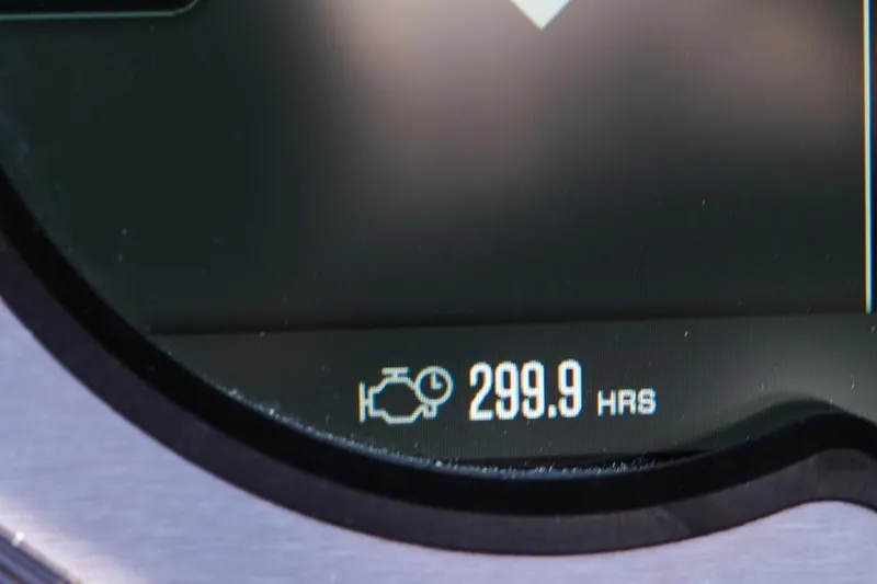 Slide: The Image of Close-up of 2023 MasterCraft XStar engine hour meter displaying 299.9 hours. - 9