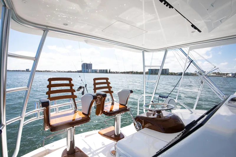 Slide: The Image of 2023 Viking 46 Billfish yacht helm with ocean view and luxurious seating. - 10