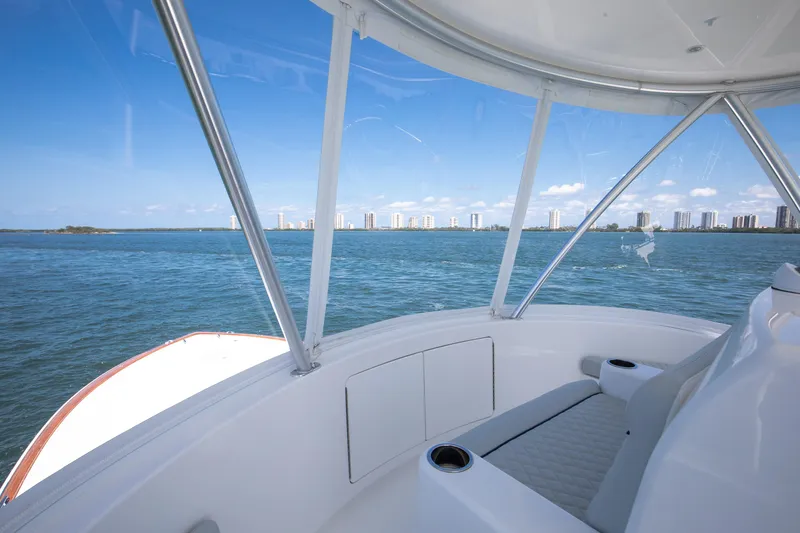 Slide: The Image of View from 2023 Viking 46 Billfish yacht, overlooking ocean and city skyline. - 11