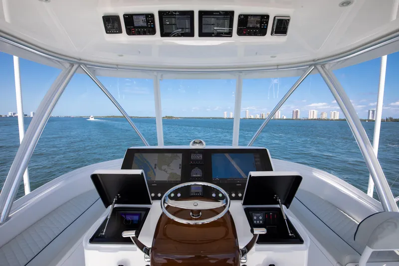 Slide: The Image of Cockpit view of 2023 Viking 46 Billfish yacht with modern navigation systems. - 12