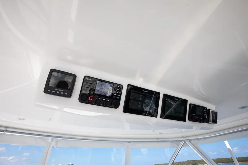 Slide: The Image of Control panel of 2023 Viking 46 Billfish with multiple electronic displays. - 13