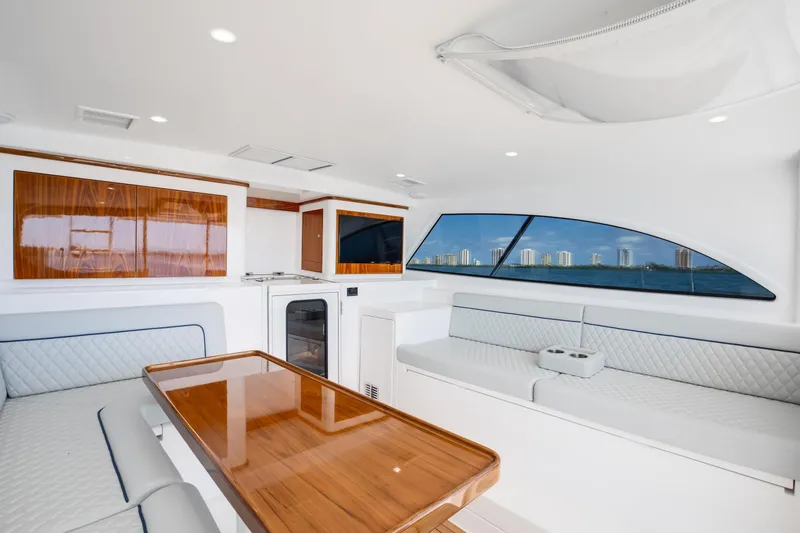 Slide: The Image of Luxurious interior of 2023 Viking 46 Billfish yacht with elegant seating and wood finishes. - 16