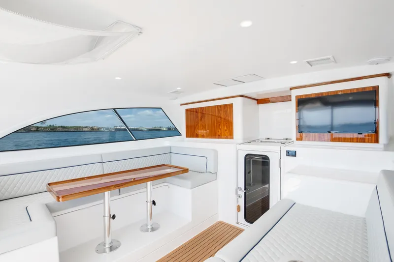 Slide: The Image of Luxurious interior of 2023 Viking 46 Billfish yacht with elegant seating and wood accents. - 17