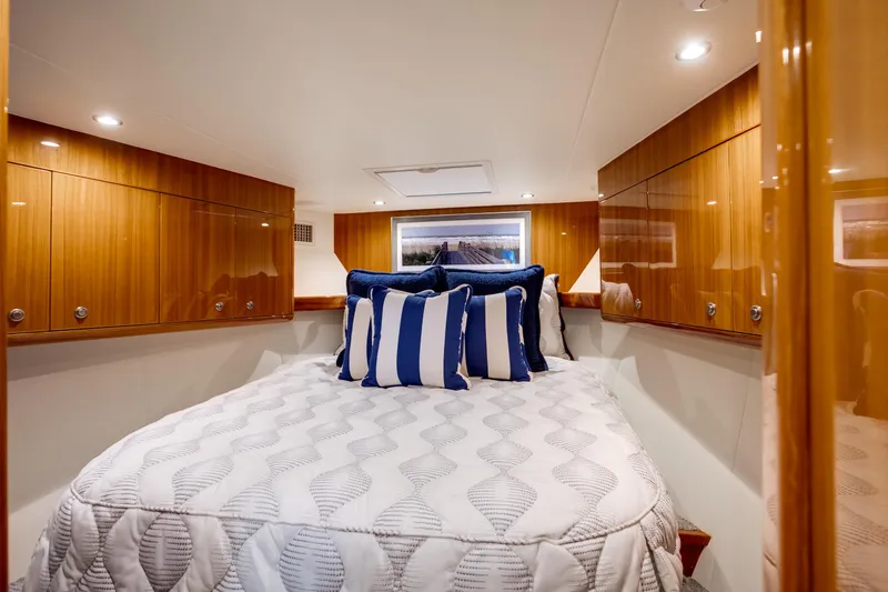 Slide: The Image of Luxurious cabin interior of 2023 Viking 46 Billfish yacht with elegant bedding and wood cabinetry. - 24