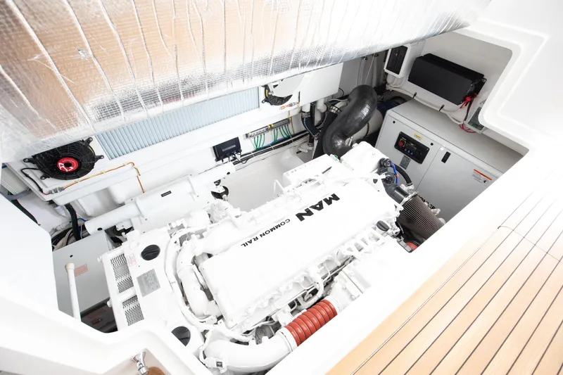 Slide: The Image of Engine room of 2023 Viking 46 Billfish yacht, featuring a MAN engine and modern equipment. - 26