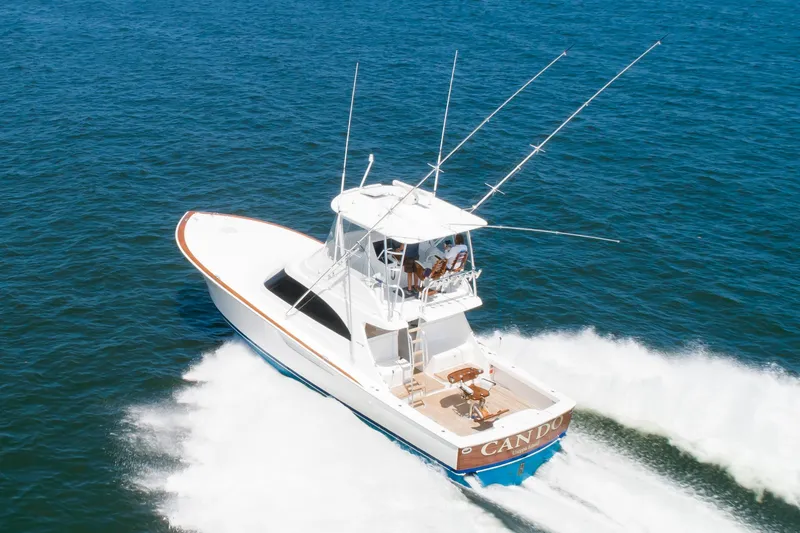 Slide: The Image of 2023 Viking 46 Billfish yacht cruising on open water, aerial view. - 5