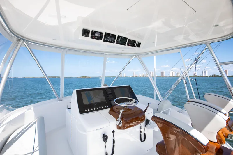Slide: The Image of Helm of 2023 Viking 46 Billfish yacht with ocean view and modern controls. - 6