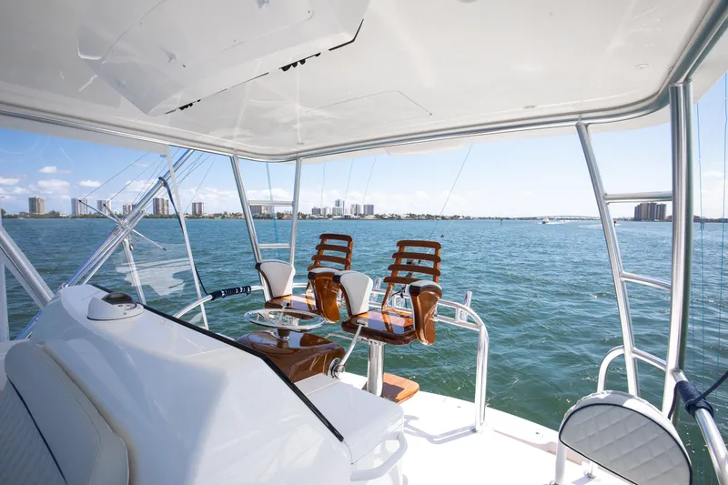 Slide: The Image of 2023 Viking 46 Billfish yacht helm with ocean view and modern seating. - 7